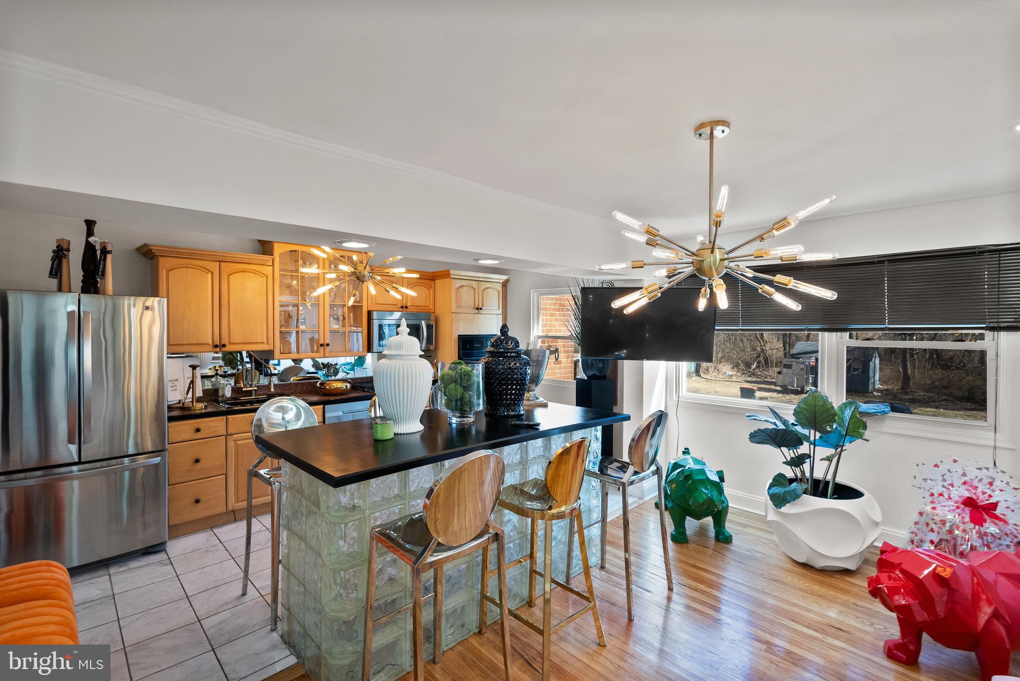 2737 East Country Club Road Philadelphia, PA 19131 - Photo 10 of 24 a very nice looking living room with a large window a dining table and chairs