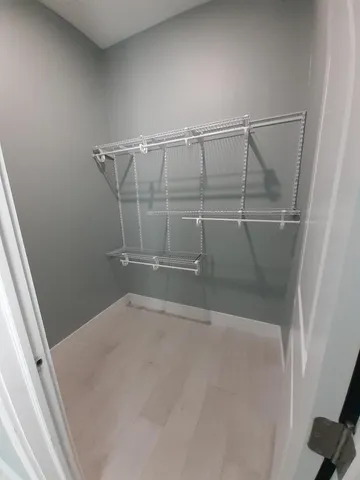 a view of a livingroom with a ceiling fan and a window