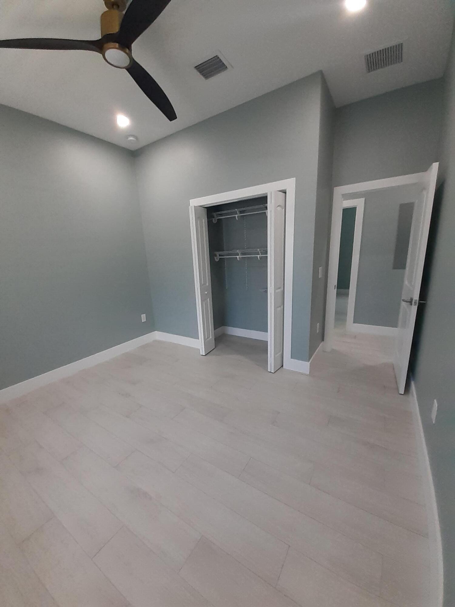 23 Jenny Lane Key Largo, FL 33037 - Photo 19 of 38 an empty room with a ceiling fan and window