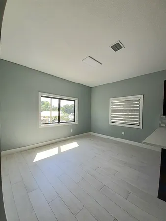 a view of an empty room with a window