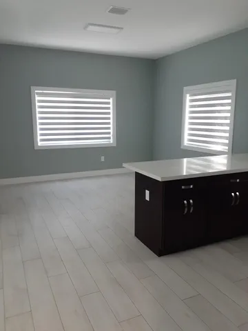 a room with a cabinet and window