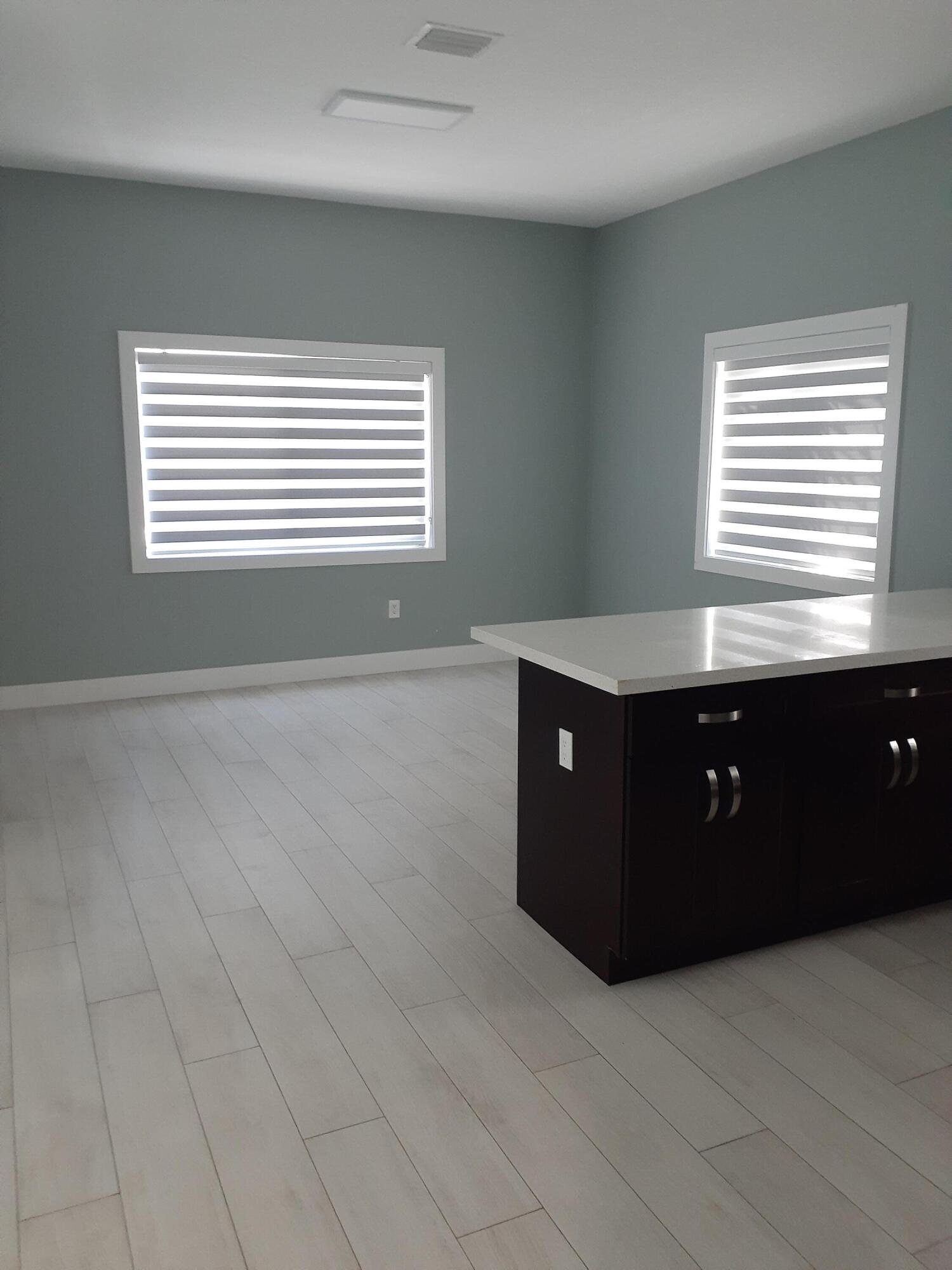 23 Jenny Lane Key Largo, FL 33037 - Photo 5 of 38 a room with a cabinet and window