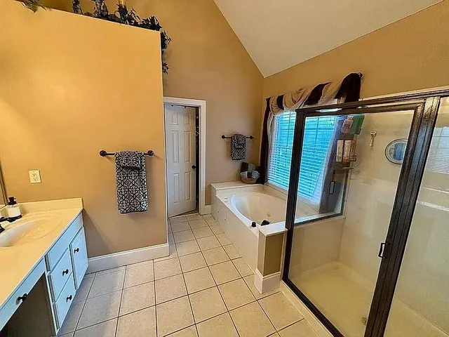 a view of kitchen with a sink and a refrigerator