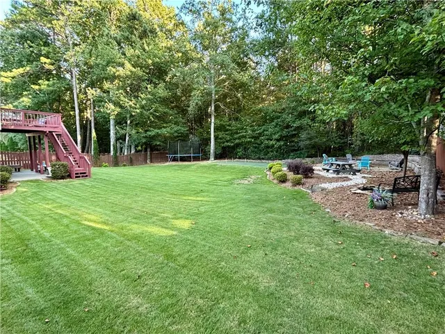 a view of yard with seating area and green space