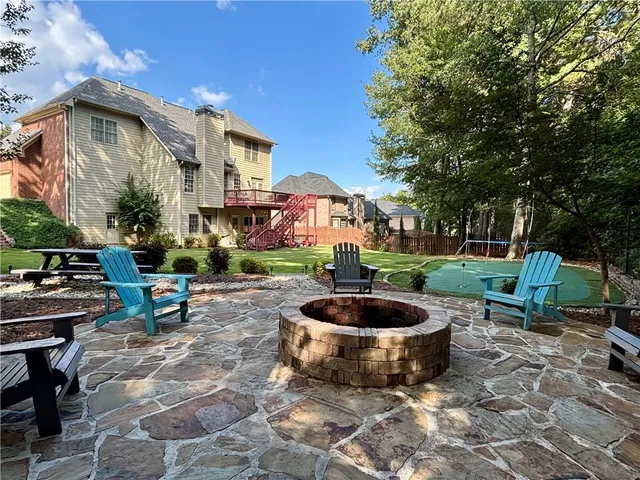 a view of a patio with chairs and tables