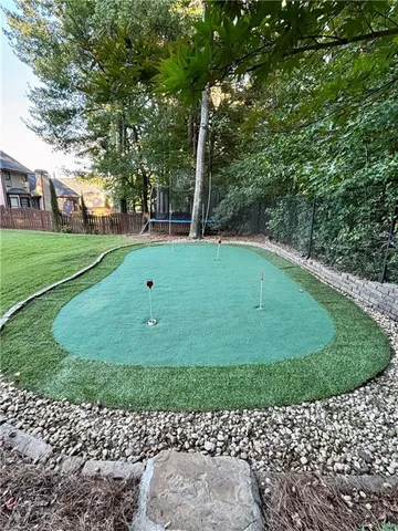 a view of a park with large trees