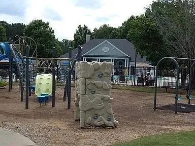 a view of a wooden house with a bench