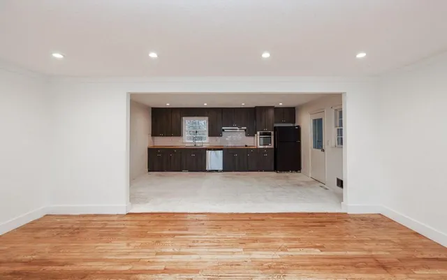 a view of kitchen and kitchen with a sink