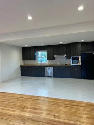 a kitchen with stainless steel appliances a cabinets and a sink
