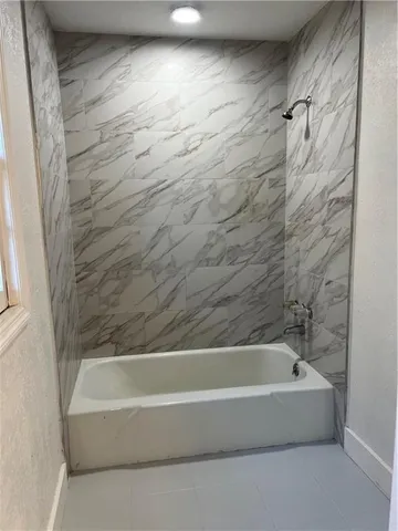 a bathroom with a bathtub