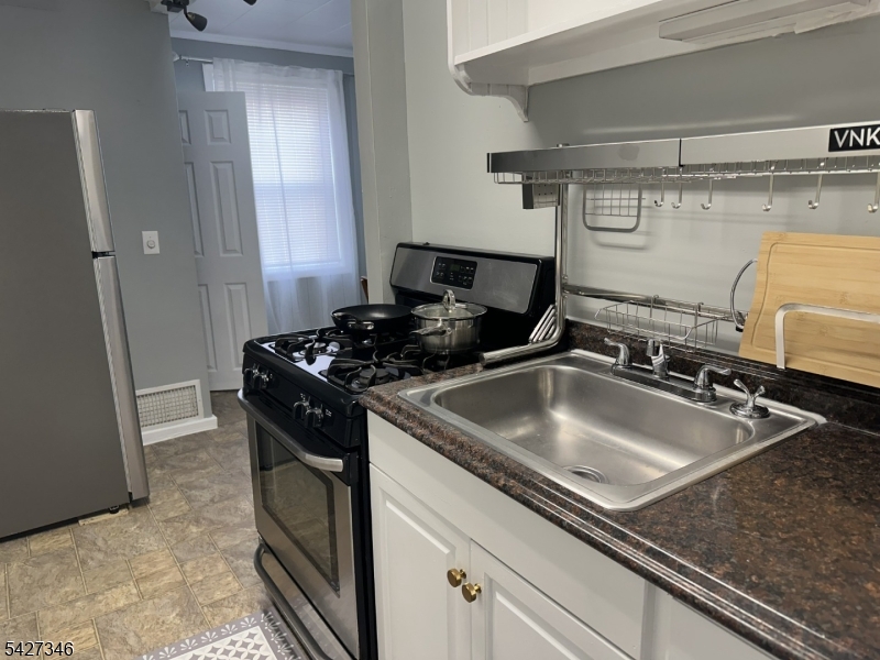 268 Chambers Street, Unit 2 Phillipsburg, NJ 08865 - Photo 6 of 9 a kitchen with a sink and a stove top oven