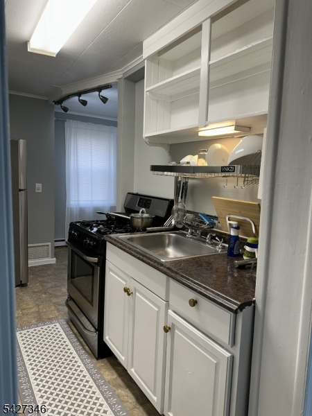 268 Chambers Street, Unit 2 Phillipsburg, NJ 08865 - Photo 7 of 9 a kitchen with a sink and a stove