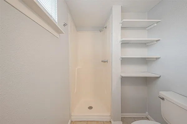 a bathroom with a sink a mirror and a shower