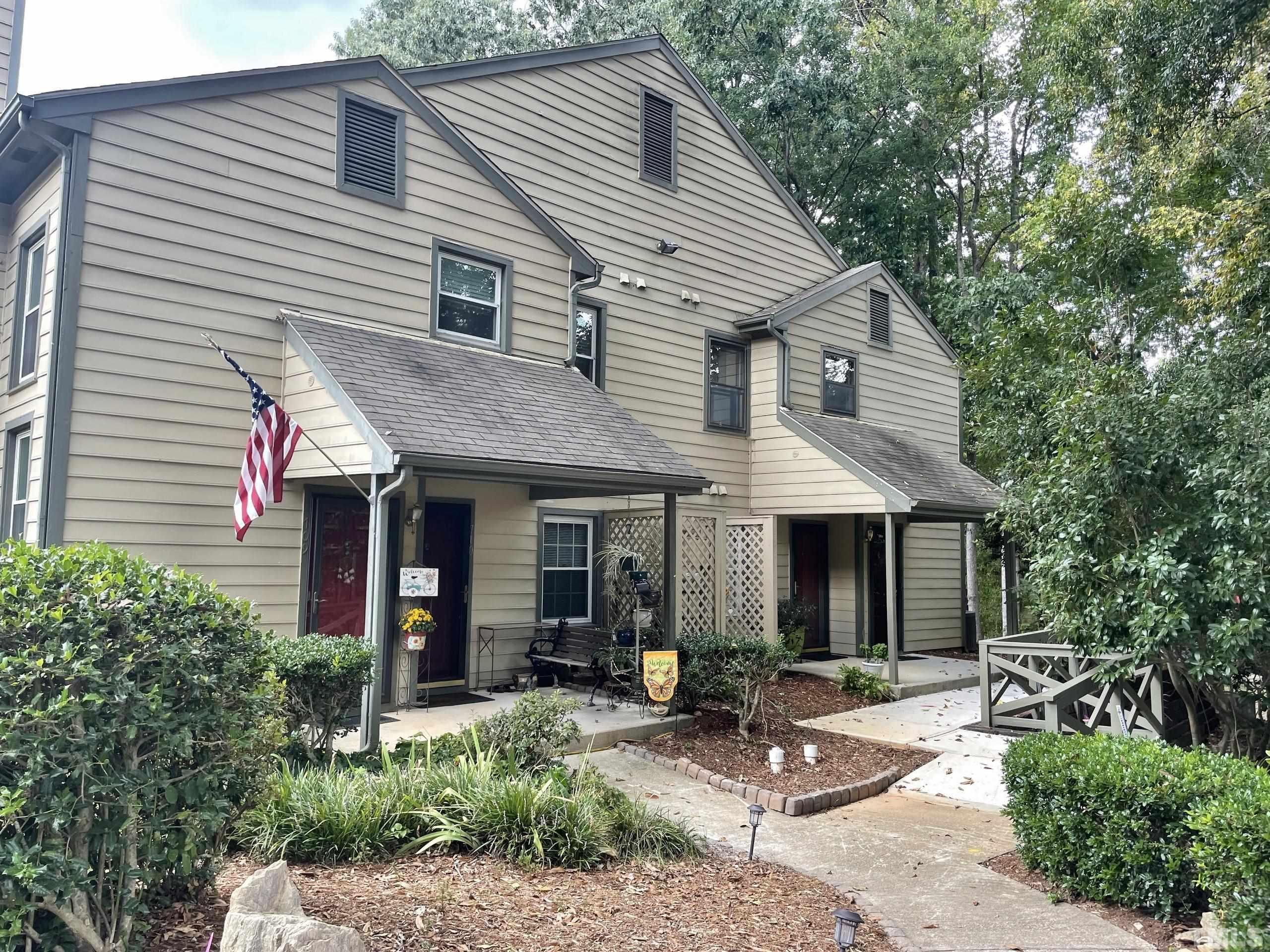 712 Broad Leaf Circle, Unit 712 Raleigh, NC 27613 - Photo 1 of 26 a view of a house with backyard