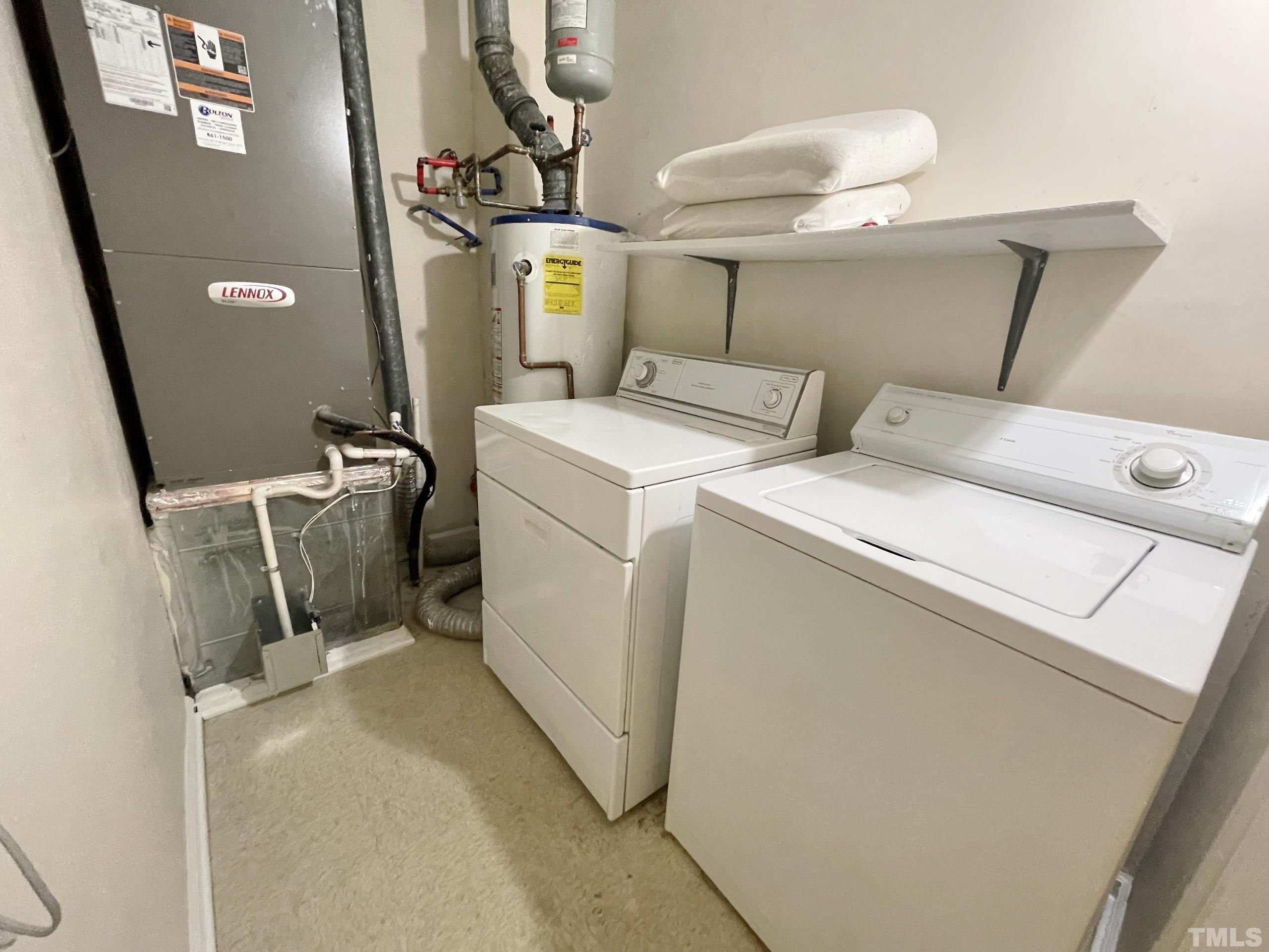 712 Broad Leaf Circle, Unit 712 Raleigh, NC 27613 - Photo 22 of 26 a utility room with dryer and washer