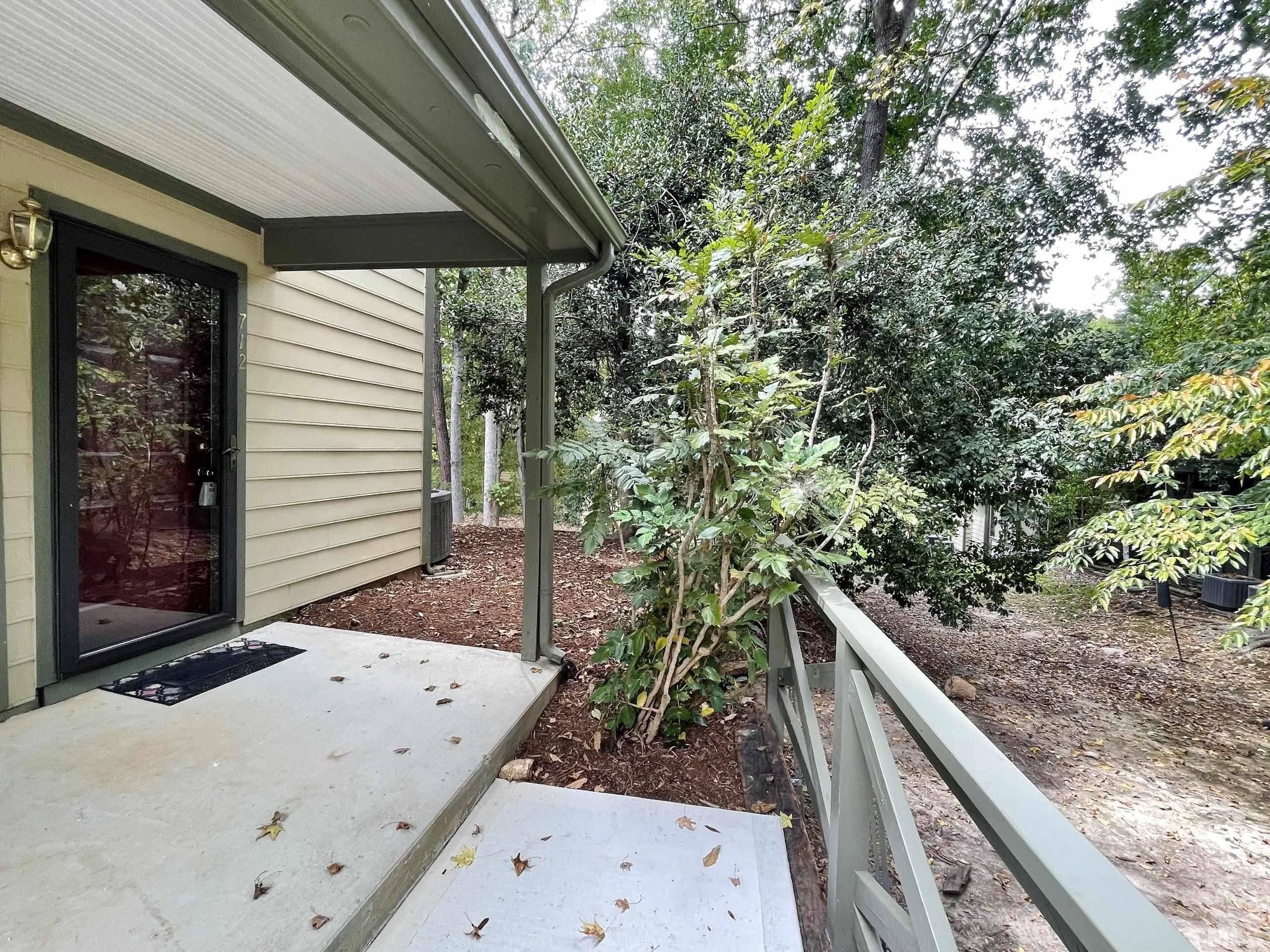 712 Broad Leaf Circle, Unit 712 Raleigh, NC 27613 - Photo 3 of 26 a view of a backyard