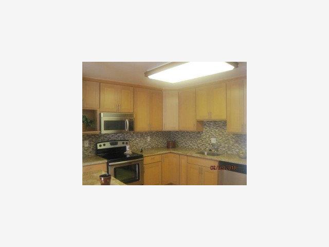 1191 Compass Lane, Unit 108 Foster City, CA 94404 - Photo 1 of 9 a bathroom with a sink a granite counter top and toilet