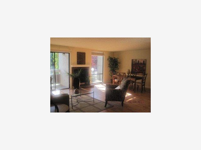 1191 Compass Lane, Unit 108 Foster City, CA 94404 - Photo 3 of 9 a living room with furniture and a fireplace