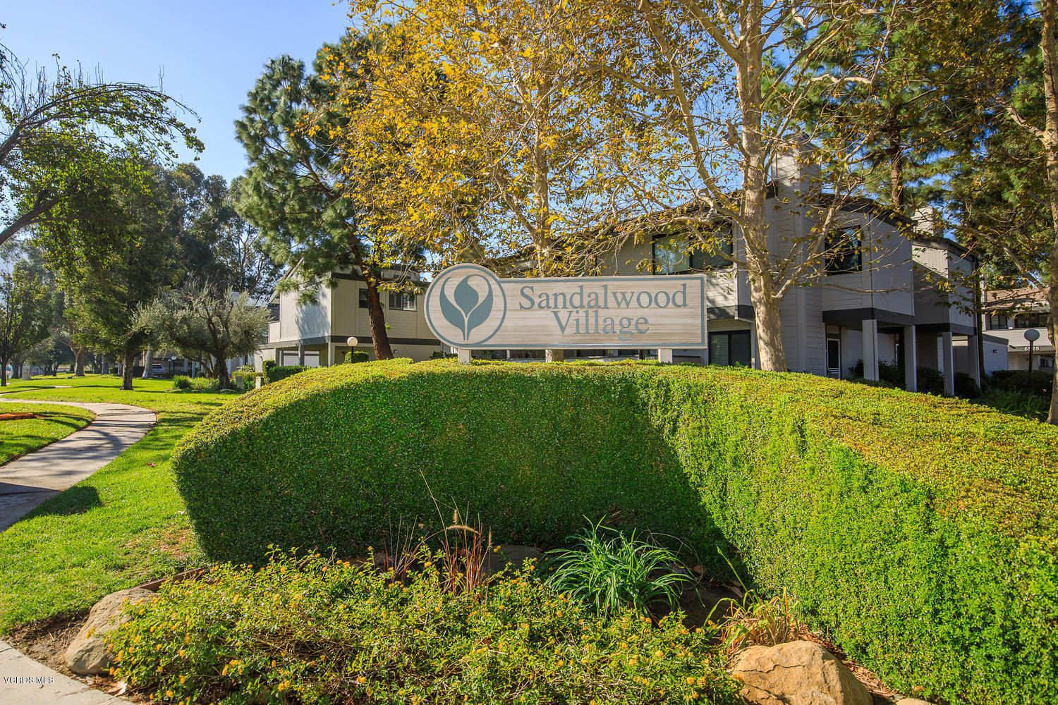 6542 Stoney View Lane, Unit 5 Simi Valley, CA 93063 - Photo 1 of 32 a view of a house with a big yard and large trees