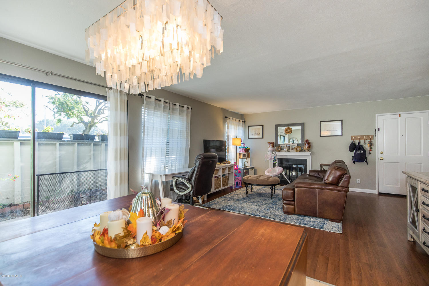 6542 Stoney View Lane, Unit 5 Simi Valley, CA 93063 - Photo 12 of 32 a living room with furniture and a chandelier