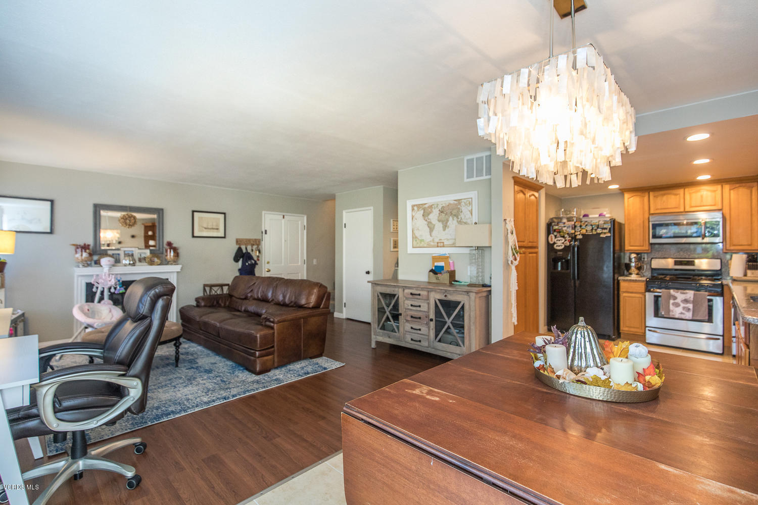 6542 Stoney View Lane, Unit 5 Simi Valley, CA 93063 - Photo 14 of 32 a living room with furniture and chandelier