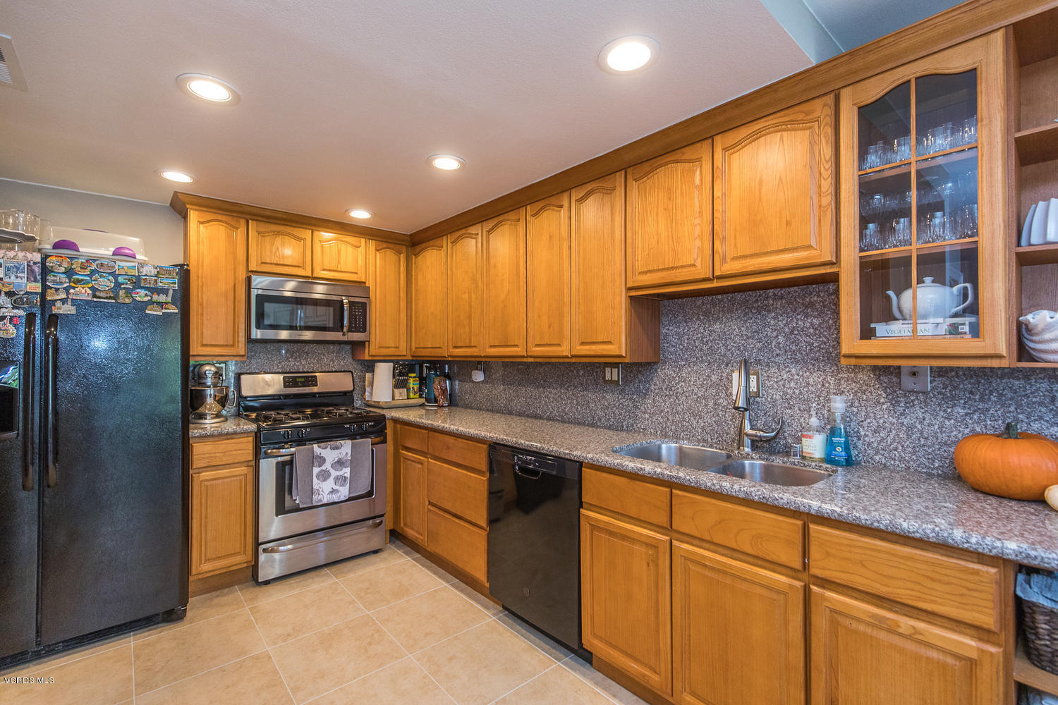 6542 Stoney View Lane, Unit 5 Simi Valley, CA 93063 - Photo 15 of 32 a kitchen with stainless steel appliances granite countertop a sink a stove and refrigerator