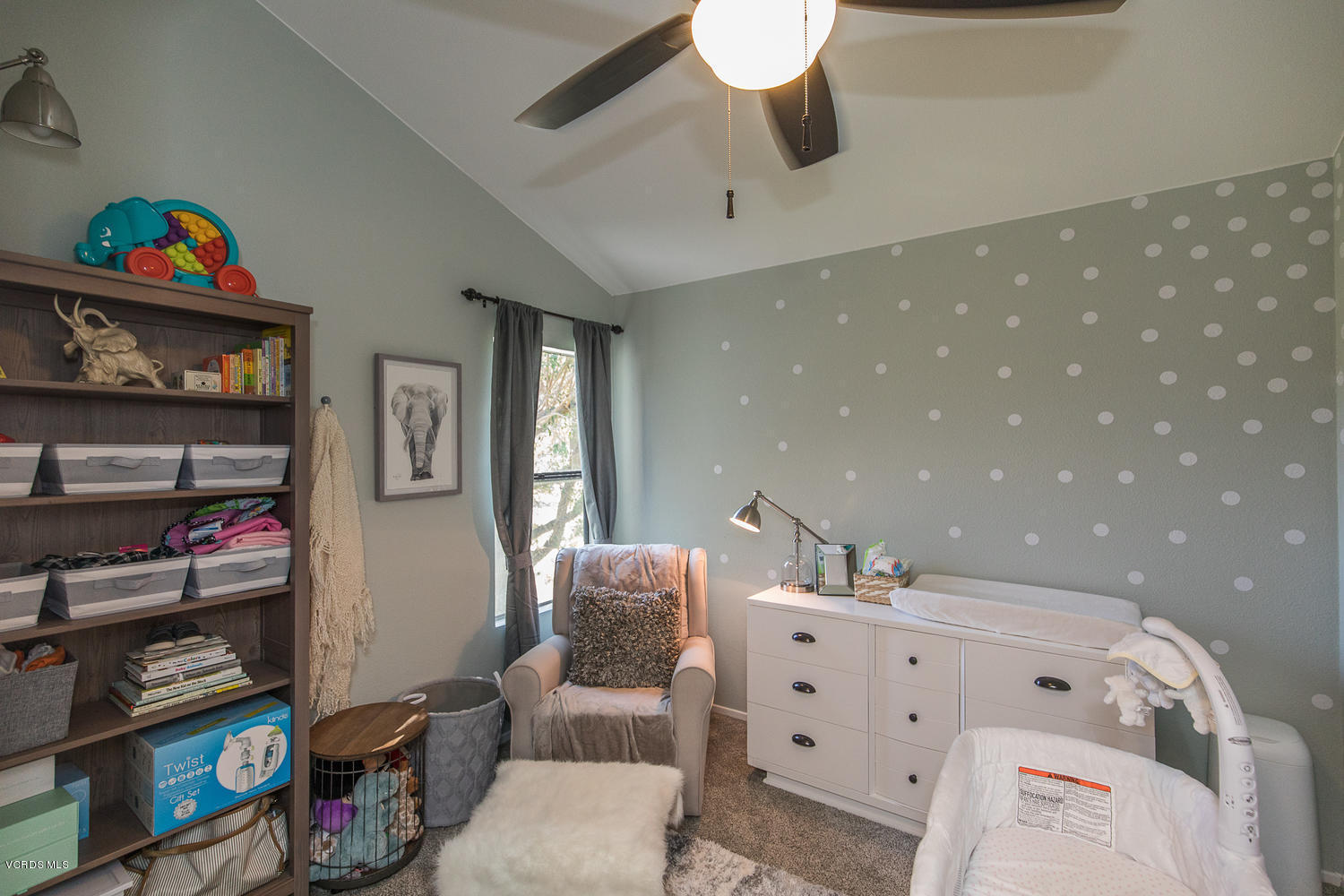 6542 Stoney View Lane, Unit 5 Simi Valley, CA 93063 - Photo 22 of 32 a living room with furniture and a shelf