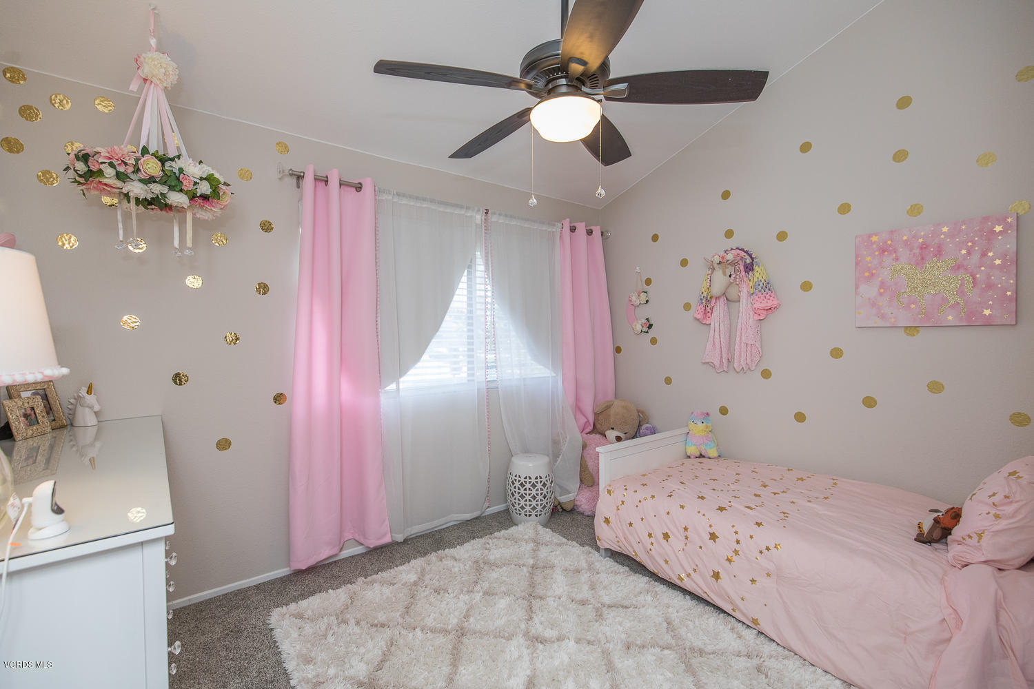 6542 Stoney View Lane, Unit 5 Simi Valley, CA 93063 - Photo 24 of 32 a bedroom with a bed and a chandelier