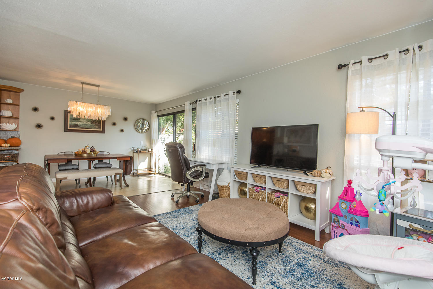6542 Stoney View Lane, Unit 5 Simi Valley, CA 93063 - Photo 7 of 32 a living room with furniture and a flat screen tv