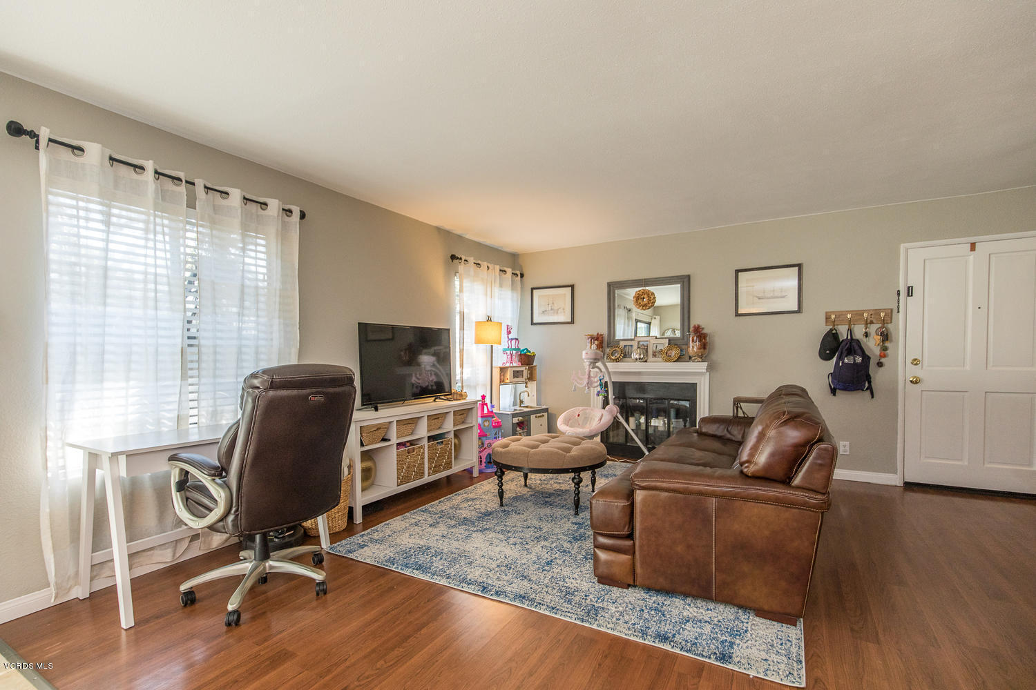 6542 Stoney View Lane, Unit 5 Simi Valley, CA 93063 - Photo 8 of 32 a living room with furniture window and a wooden floor