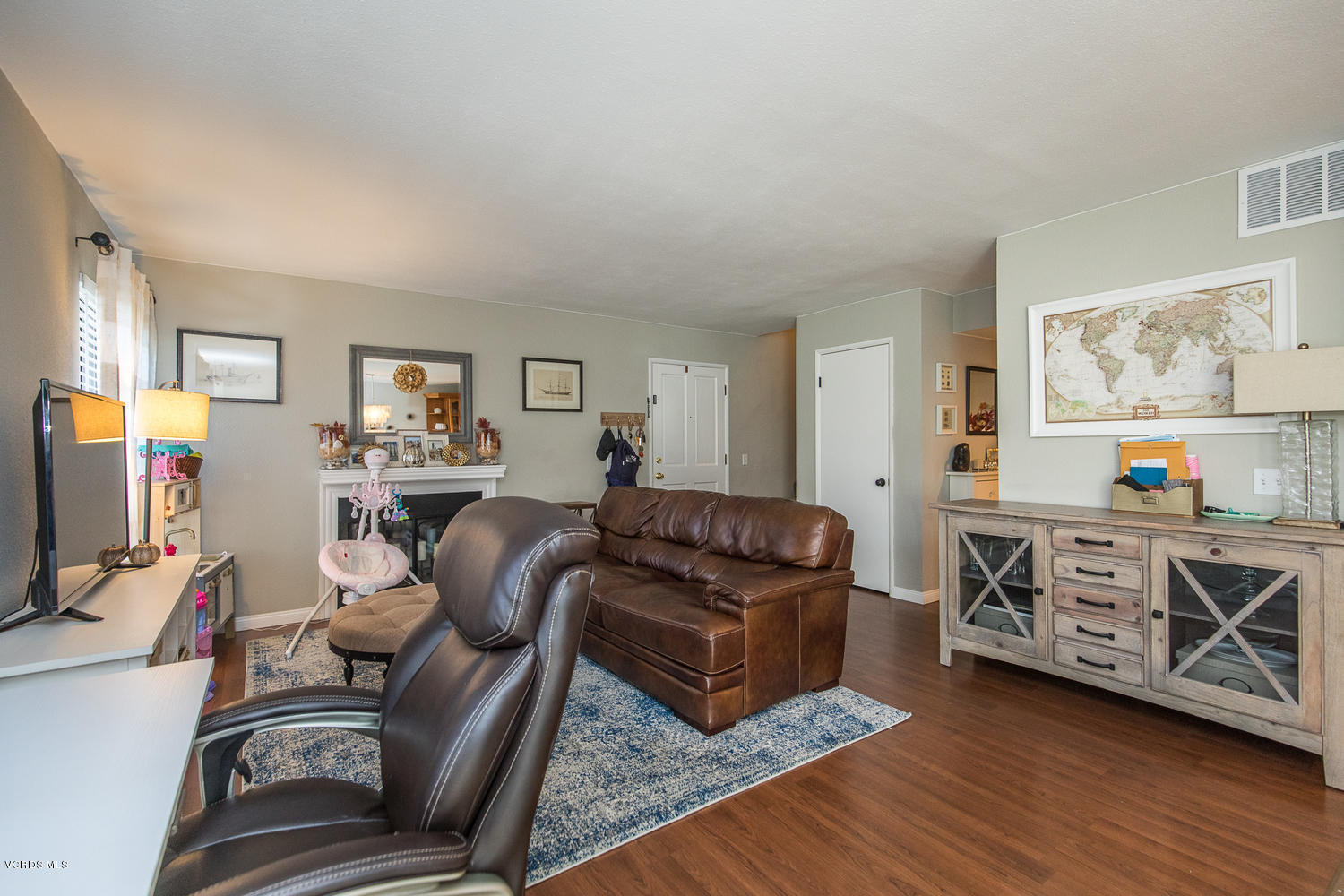 6542 Stoney View Lane, Unit 5 Simi Valley, CA 93063 - Photo 9 of 32 a living room with furniture and a flat screen tv