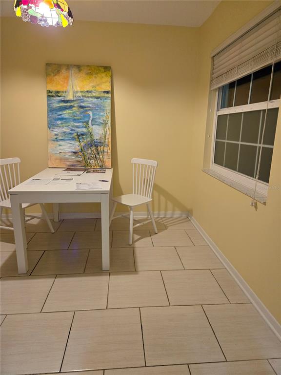 1701 Pinehurst Road, Unit 3E Dunedin, FL 34698 - Photo 7 of 10 a kitchen with a stove top oven and cabinets