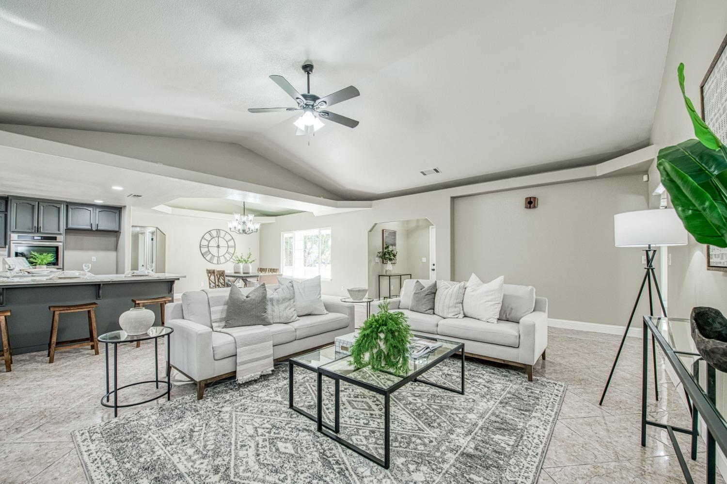 24607 Gardena Drive Madera, CA 93638 - Photo 11 of 74 a living room with furniture and a large window