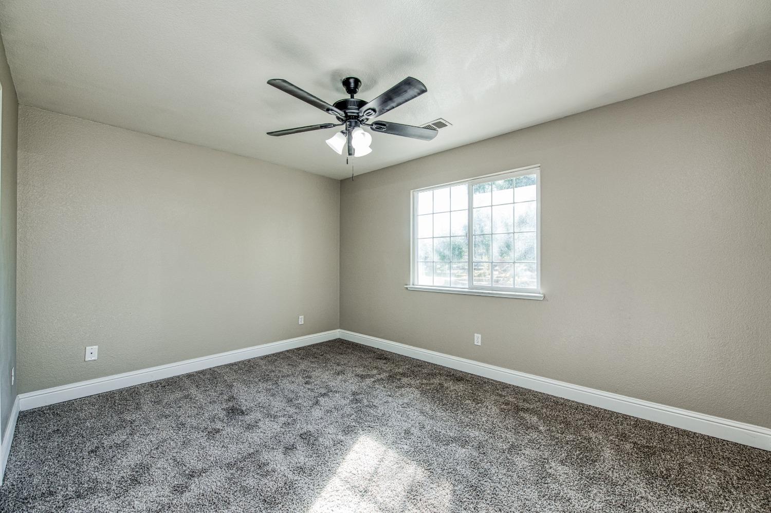 24607 Gardena Drive Madera, CA 93638 - Photo 32 of 74 a view of a big room with carpet