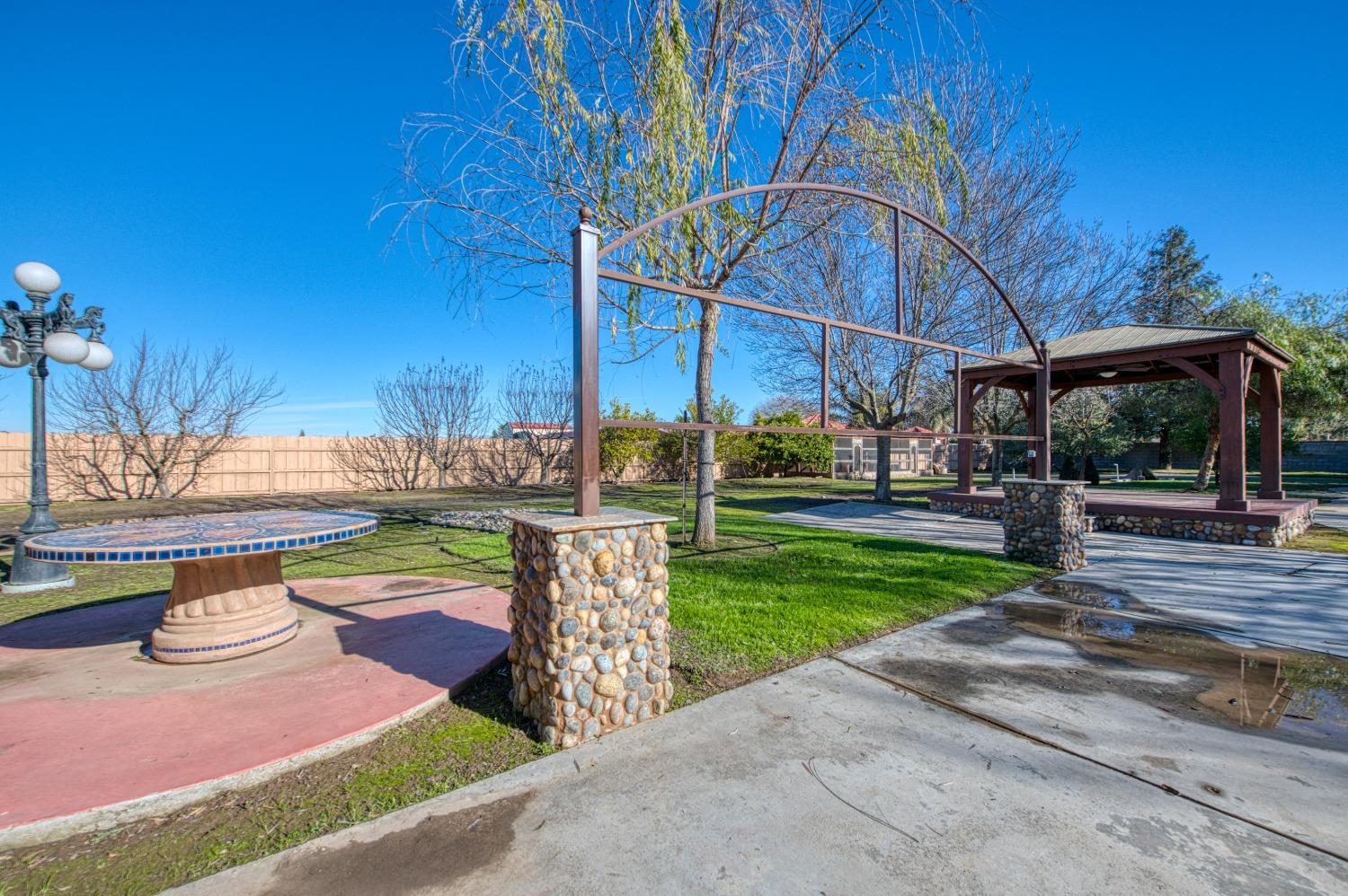 24607 Gardena Drive Madera, CA 93638 - Photo 48 of 74 a view of a backyard with sitting area