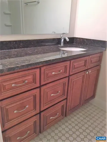 a bathroom with a sink and vanity