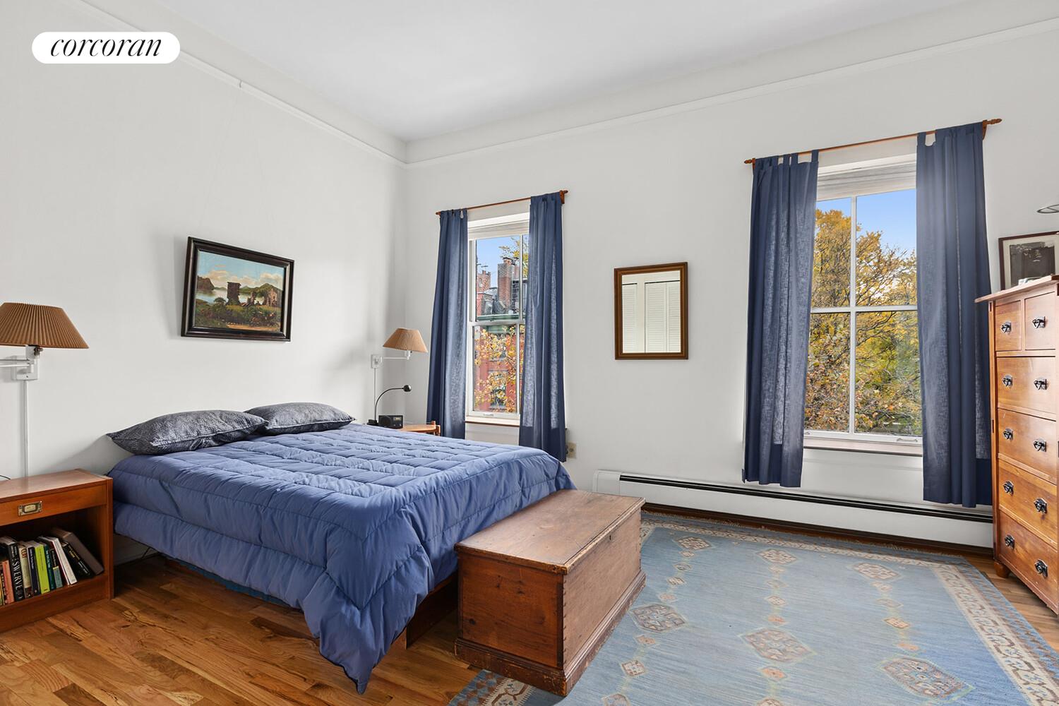 471 West 22nd Street, Unit F Manhattan, NY 10011 - Photo 6 of 13 a bedroom with a bed and a dresser next to a window