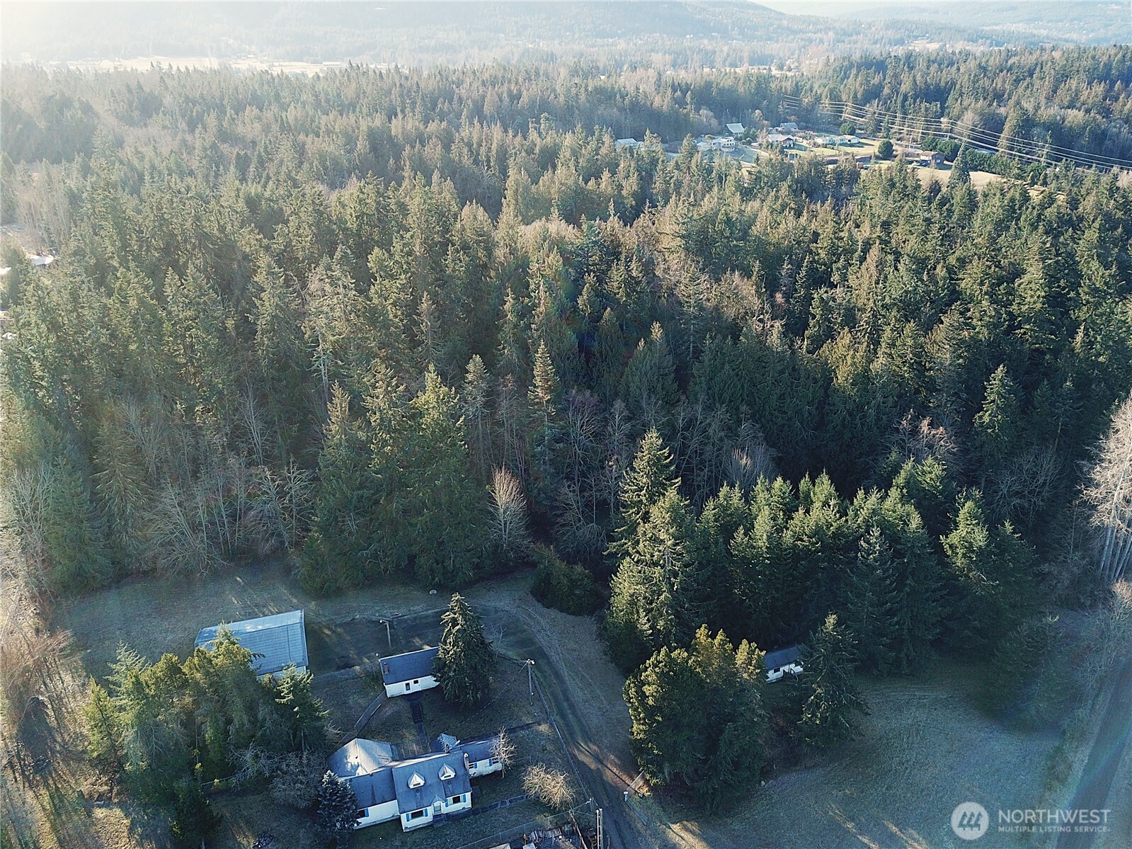 9999 South Sequim Avenue Sequim, WA 98382 - Photo 3 of 13 an aerial view of a house with a yard