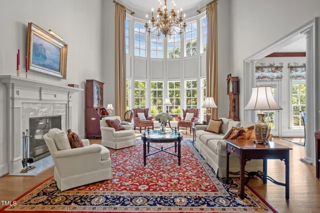 a view of a a dining room with furniture window and wooden floor