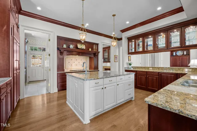 a dining room with furniture and a floor to ceiling window