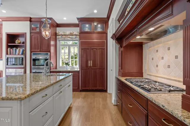 a bedroom with a bed and glass window