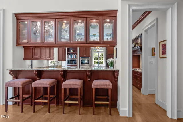a view of a hallway and a livingroom with furniture