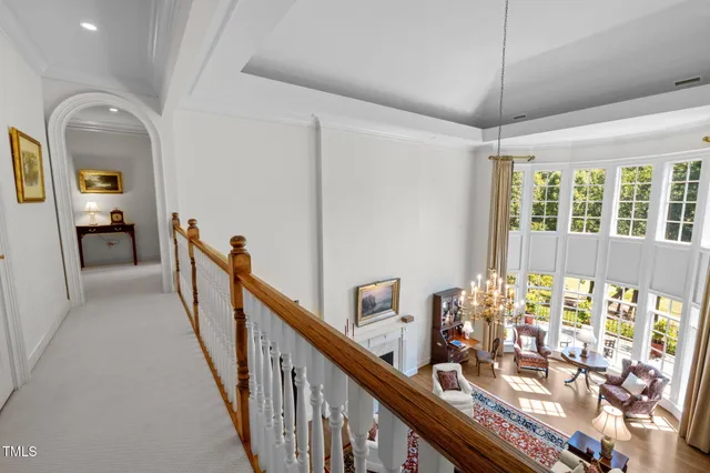 a bedroom with two beds and a large window