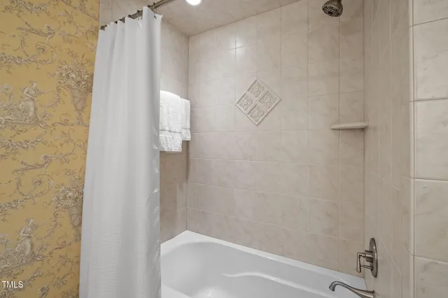 a view of a hallway with wooden floor and entryway