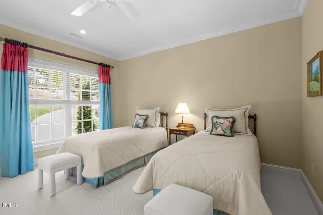 an aerial view of a house with a yard and lake view