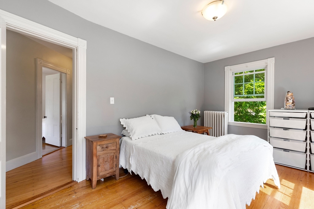 45 Reed Street Lexington, MA 02421 - Photo 23 of 35 a bedroom with a bed and a window