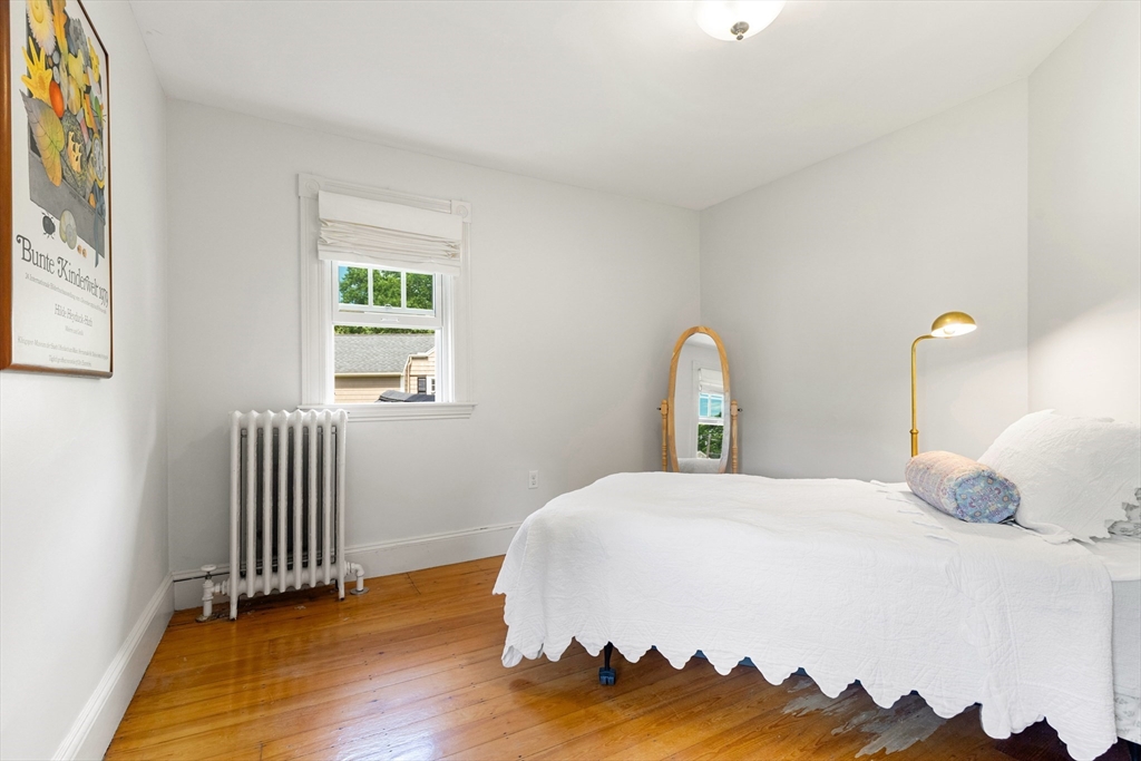 45 Reed Street Lexington, MA 02421 - Photo 24 of 35 a bedroom with a bed and a window