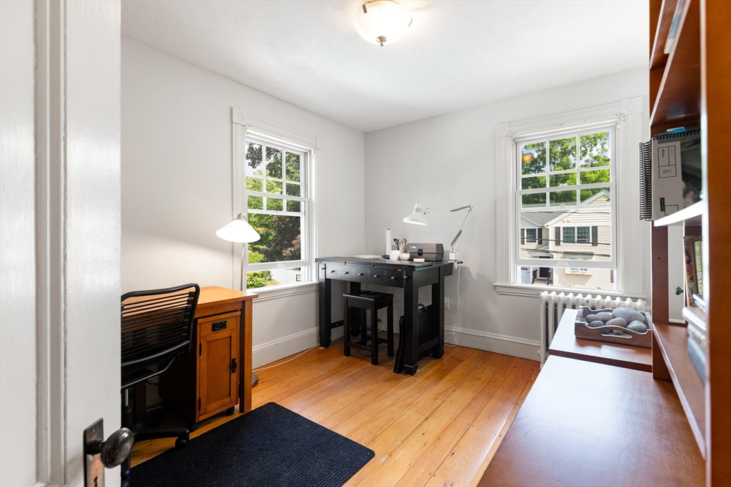 45 Reed Street Lexington, MA 02421 - Photo 27 of 35 a view of a workspace with furniture and a window