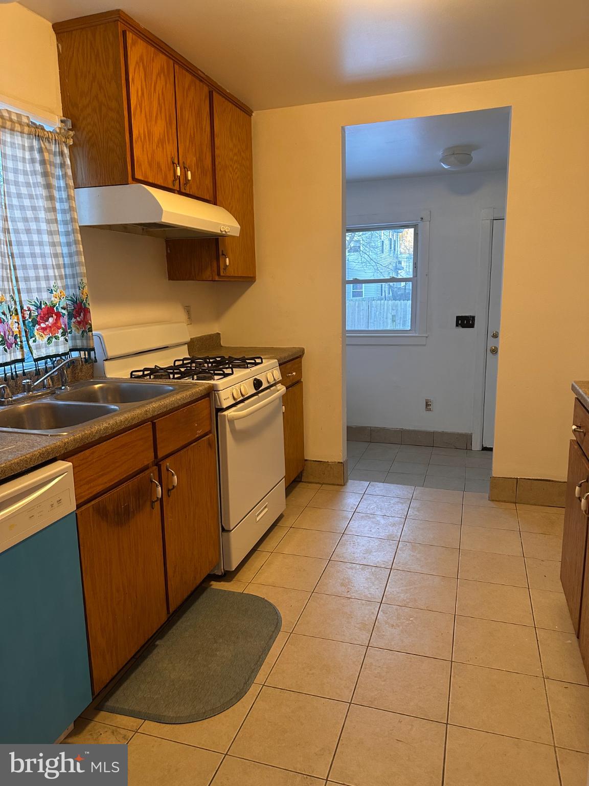317 South 3rd Street Millville, NJ 08332 - Photo 3 of 8 a kitchen with cabinets and a stove top oven