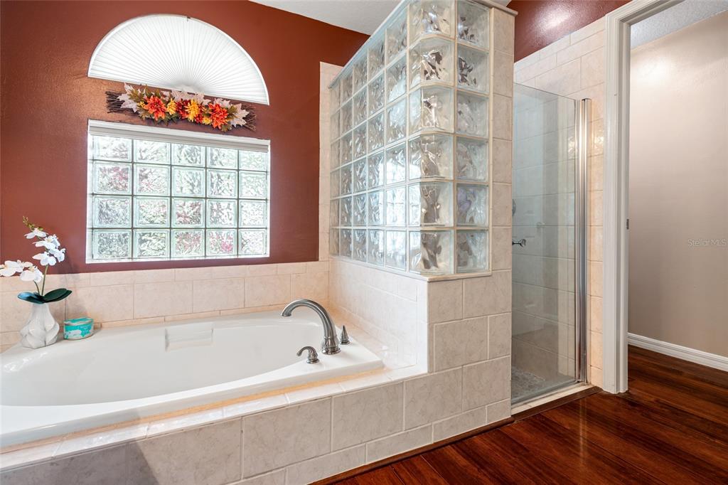 28390 Openfield Loop Wesley Chapel, FL 33543 - Photo 13 of 44 a white bath tub sitting next to a window
